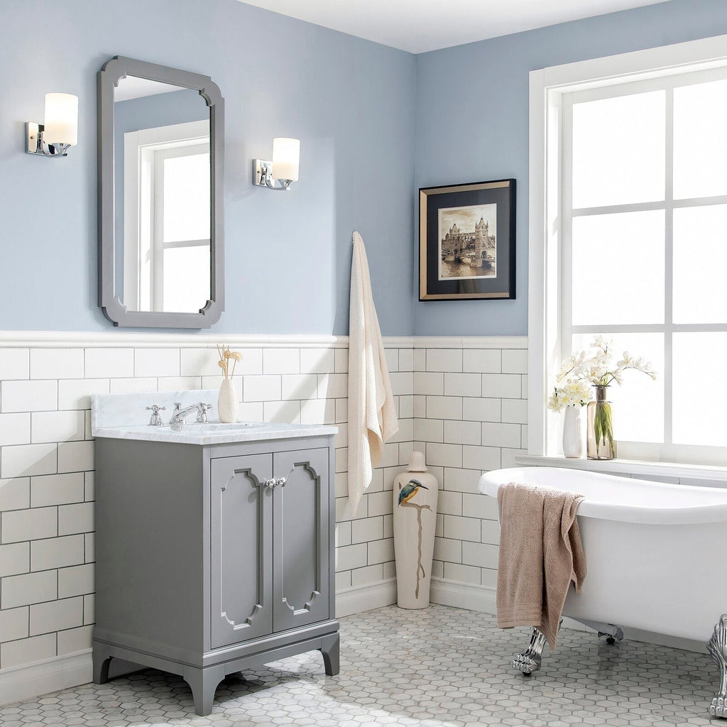 Cashmere grey 30-inch single-sink vanity with Carrara white marble countertop, chrome classic faucet and matching mirror, styled in a light-blue bathroom with white subway tile, wall sconces, decorative vase and clawfoot tub.