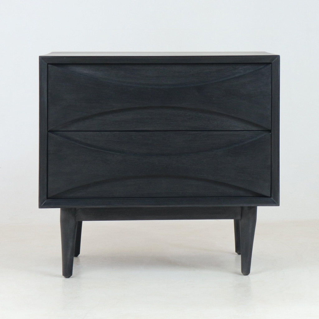 Front view of a mid-century modern solid wood nightstand in smoked black finish, with two sculpted drawers featuring curved recessed fronts and tapered legs on a plain white studio background.