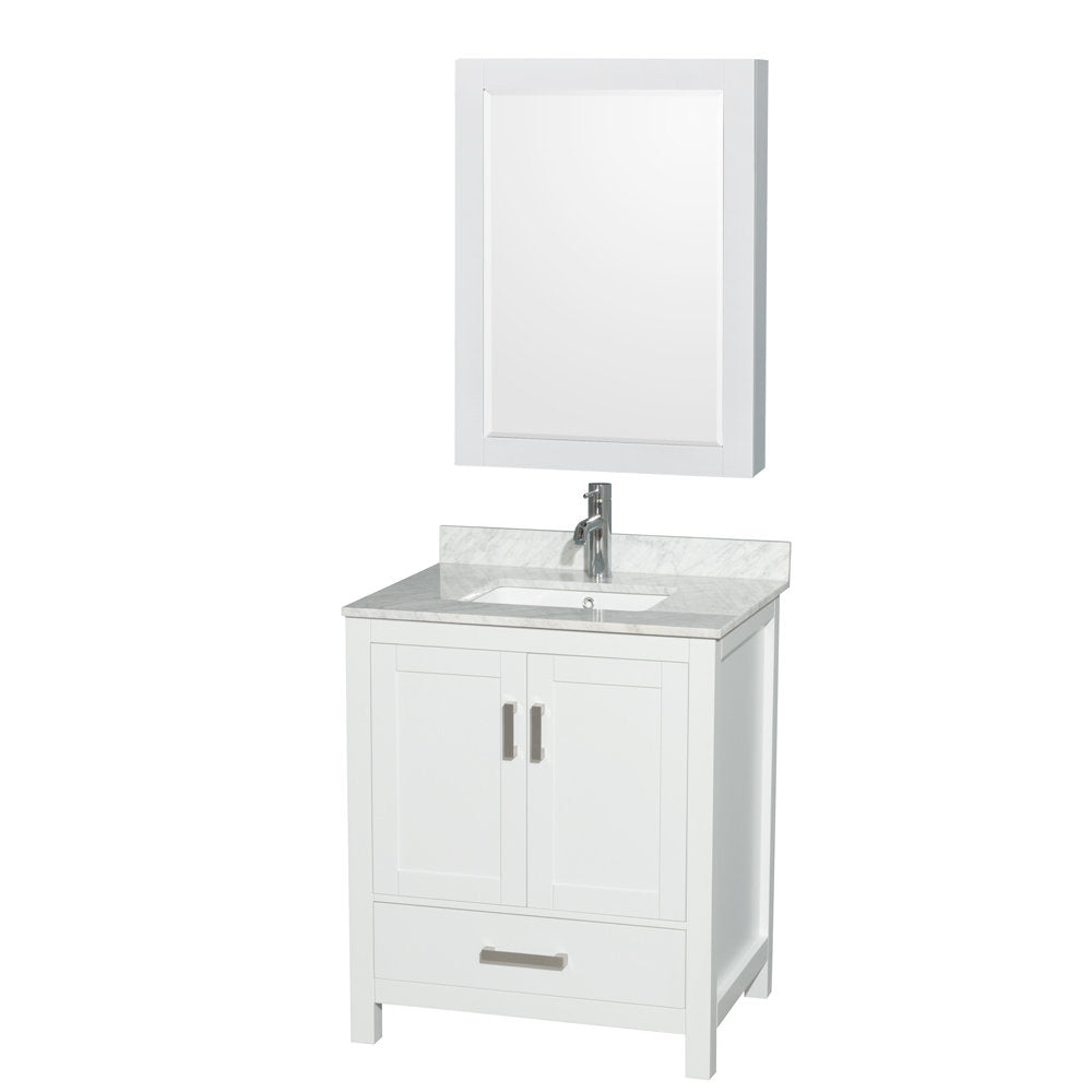 White solid-wood freestanding bathroom vanity with a light stone (marble-look) countertop, integrated undermount sink, chrome single-handle faucet, two cabinet doors, lower storage drawer, and matching framed mirror above.