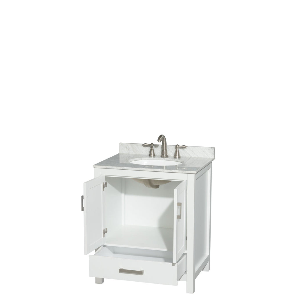 Modern freestanding white solid-wood bathroom vanity with stone marble top and backsplash, round undermount ceramic sink, brushed-nickel faucet, open cabinet doors revealing interior shelf and open bottom drawer.