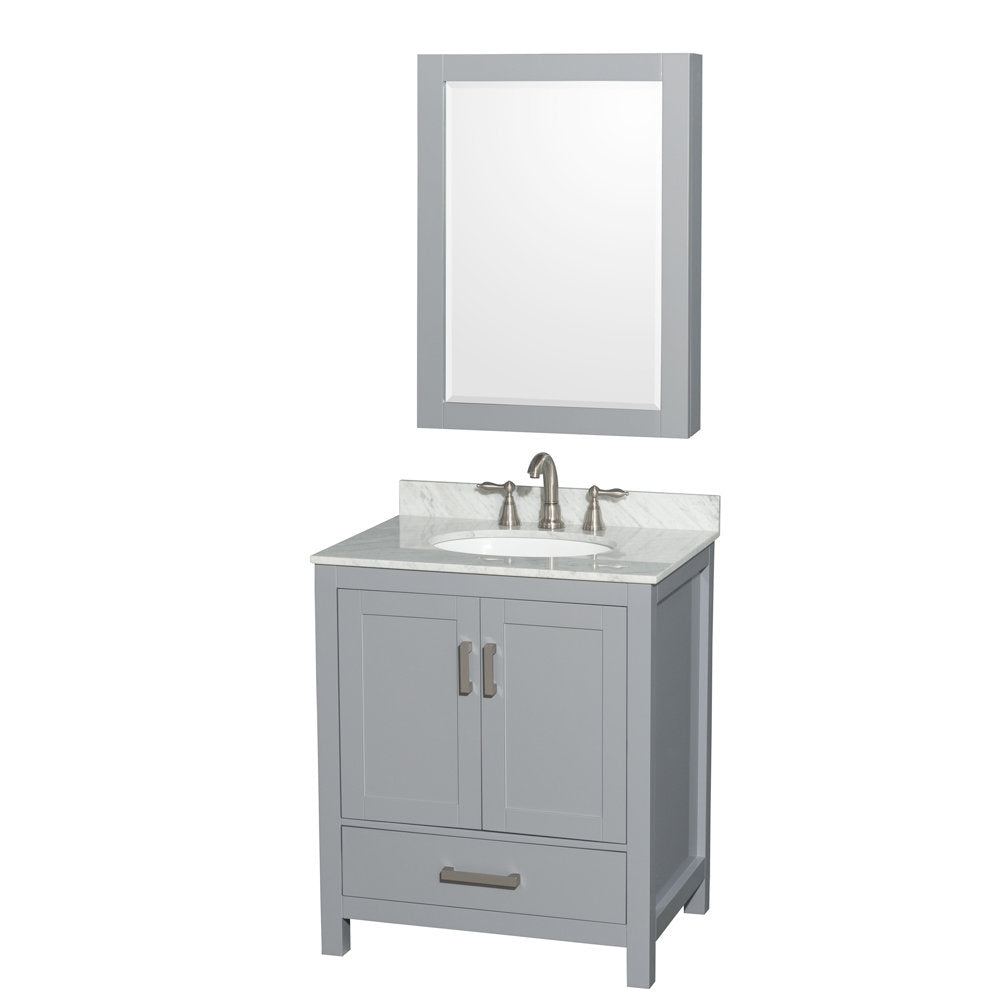 Freestanding gray solid wood bathroom vanity with stone countertop and short backsplash, white oval ceramic sink, two-door cabinet and bottom drawer, brushed nickel faucet and matching hardware, paired with a framed mirror.